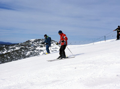 Skiers Skiing on Slope at Mount Hotham, High Country, Victoria, Australia