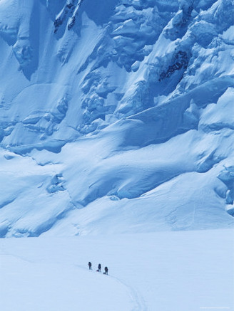 Three People Skiing Up the Kahiltna Glacier on Denali, Alaska