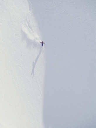 Overhead View of Skier Skiing Down Slope