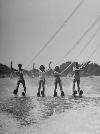 Four People Competing in the National Water Skiing Championship Tournament