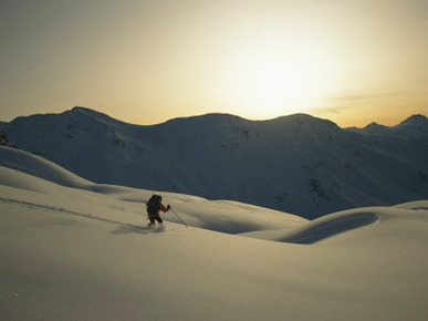 A Man Skiing the Purcell Mountains at Twilight