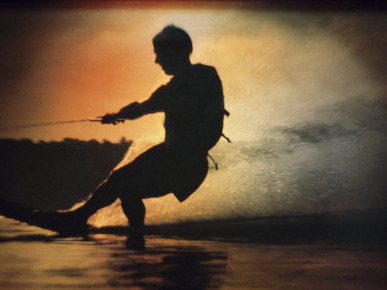 Silhouette of a Man Water Skiing