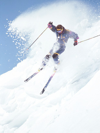 Alpine Skiing, Downhill Skier Blasting a Cornice