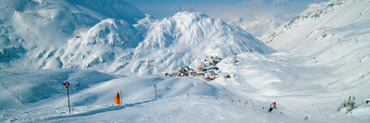 Rear View of a Person Skiing in Snow, St. Christoph, Austria